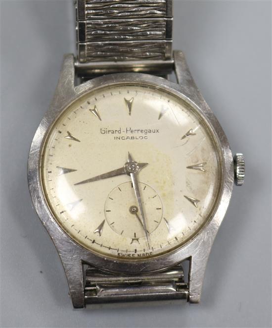 A gentlemans 1950s? stainless steel Girard Perregaux manual wind wrist watch.